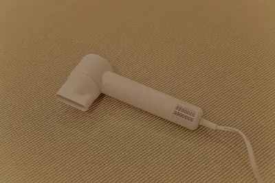 a white hair brush sitting on top of a table at Hotel Shitamachi Place Asakusa in Tokyo