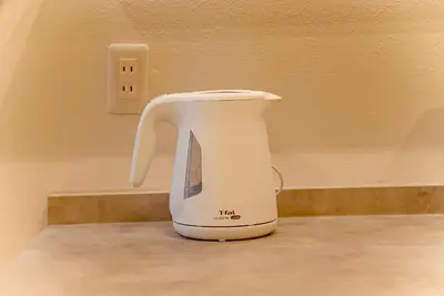 a white electric blender sitting on a counter at Hotel Shitamachi Place Asakusa in Tokyo