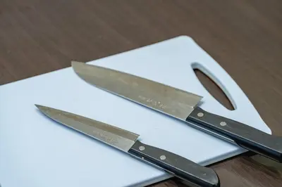 a pair of knives sitting on top of a table at APA SERVICED RESIDENCE SHINJUKU by unito in Tokyo