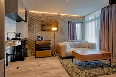 a living room with a couch and a table at STUMP SA MinamiAzabu in Tokyo