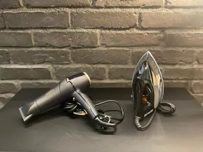 a hair dryer sitting on a table next to a brick wall at STUMP SA MinamiAzabu in Tokyo