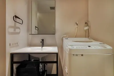 a small bathroom with a sink and a mirror at STUMP SA MinamiAzabu in Tokyo