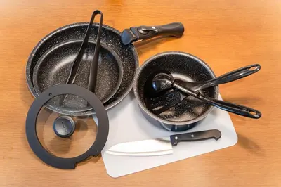 a pair of pans and utensils on a table at T4U Shinjyuku in Tokyo