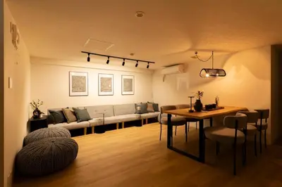 a living room with a couch and a table at T4U Shinjyuku in Tokyo
