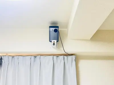a camera on a wall with a curtain at ying-Kabukicho 1F-SJ0066 in Tokyo