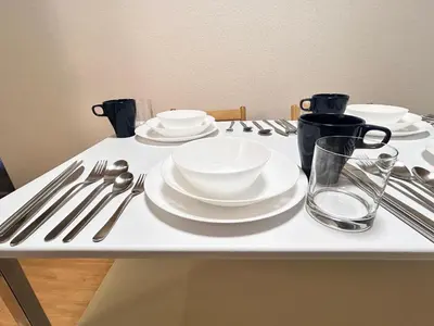 a table with white plates and utensils on it at ying-Kabukicho 1F-SJ0066 in Tokyo