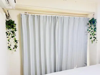 a white curtain in a bedroom with a window at ying-Kabukicho 1F-SJ0066 in Tokyo