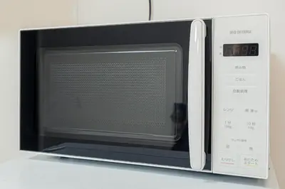 a microwave oven sitting on top of a counter at Stay \u6b4c\u821e\u4f0e\u753a A in Tokyo