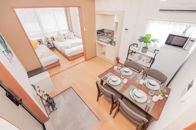 an overhead view of a dining room and living room at Stay \u6b4c\u821e\u4f0e\u753a A in Tokyo