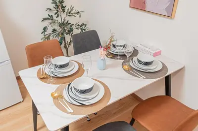 a white table with hats and plates on it at Stay \u6b4c\u821e\u4f0e\u753a A in Tokyo