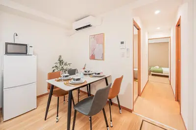 a kitchen and dining room with a table and chairs at Stay \u6b4c\u821e\u4f0e\u753a A in Tokyo