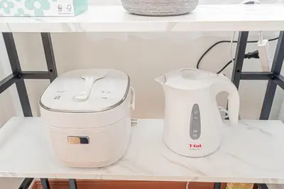 a white electric mixer on a shelf at Stay \u6b4c\u821e\u4f0e\u753a A in Tokyo