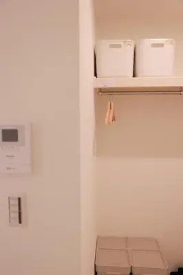a closet with a shelf with two rolls of toiletries at Room #102 - Cozy Stay Higashi Ikebukuro in Tokyo