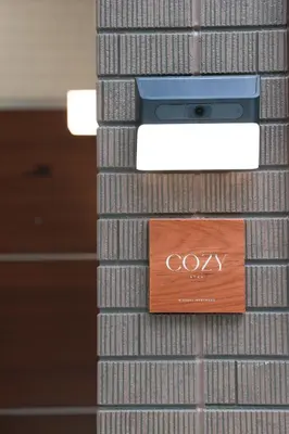 a sign that says coxy on a wall at Room #201 - Cozy Stay Higashi Ikebukuro in Tokyo
