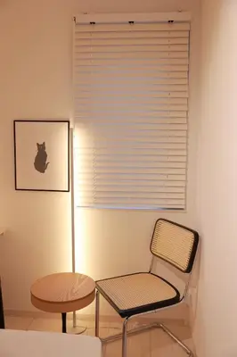 a chair and a table and a lamp in a room at Room #201 - Cozy Stay Higashi Ikebukuro in Tokyo