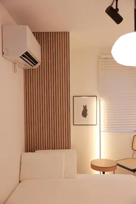a bedroom with a bed and a chair and a table at Room #202 - Cozy Stay Higashi Ikebukuro in Tokyo