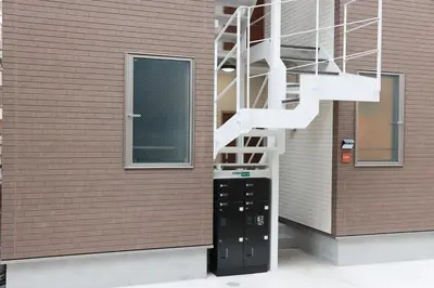 a building with a staircase on the side of it at Room #202 - Cozy Stay Higashi Ikebukuro in Tokyo