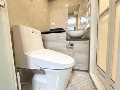 a bathroom with a white toilet and a sink at Shinjuku downtown B2 in Tokyo