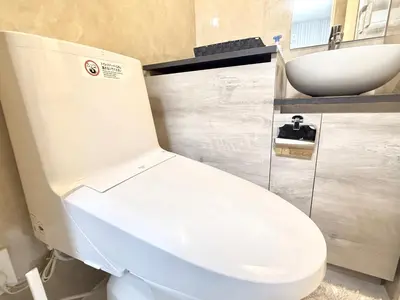 a bathroom with a white toilet and a sink at Shinjuku downtown B2 in Tokyo