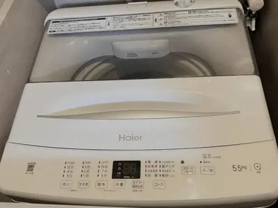 a washing machine with the words heir in front of it at Shinjuku downtown B2 in Tokyo