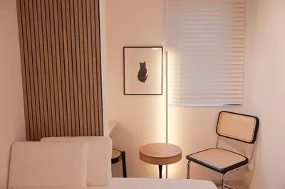 a bedroom with a bed and a chair and a lamp at Room #301 - Cozy Stay Higashi Ikebukuro in Tokyo