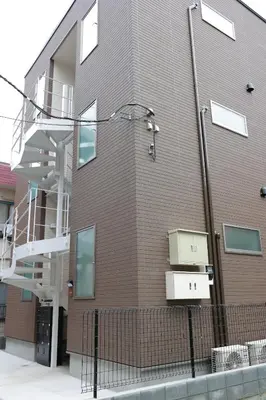 a building with a staircase on the side of it at Room #301 - Cozy Stay Higashi Ikebukuro in Tokyo
