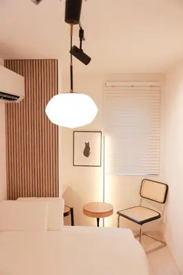 a bedroom with a bed and a table and a chair at Room #302 - Cozy Stay Higashi Ikebukuro in Tokyo