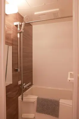 a bathroom with a tub and a shower at Room #302 - Cozy Stay Higashi Ikebukuro in Tokyo
