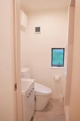 a bathroom with a toilet and a sink and a window at Room #302 - Cozy Stay Higashi Ikebukuro in Tokyo