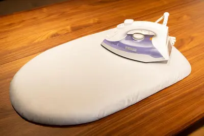 a iron sitting on top of a white pillow at Yadori\u795e\u697d\u5742 in Tokyo