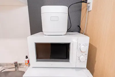a food processor sitting on top of a microwave at Komorebi Asakusa Cozy 4P Stay The 77 House Tokyo in Tokyo