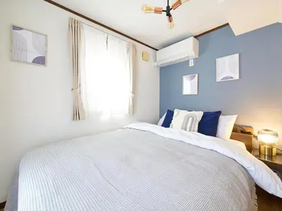 a bedroom with a white bed and a window at The Prime TOKYO SKYTREE in Tokyo