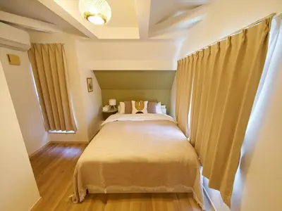 a bedroom with a large bed in a room at The Prime TOKYO SKYTREE in Tokyo