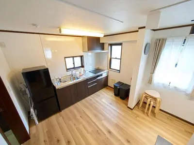 a small kitchen with a sink and a refrigerator at The Prime TOKYO SKYTREE in Tokyo