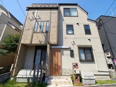 a house with two chairs in front of it at The Prime TOKYO SKYTREE in Tokyo
