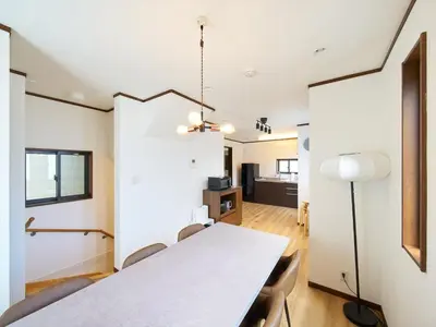 a dining room with a white table and chairs at The Prime TOKYO SKYTREE in Tokyo