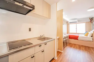 a kitchen with a sink and a bed in a room at Komorebi Asakusa A5 Cozy 4P StayThe 77 House Tokyo in Tokyo