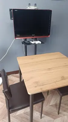 a computer monitor sitting on top of a desk at Y's House Okubo in Tokyo
