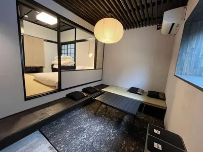 a room with a bench and a large mirror at \u3077\u3075\u304b\u5186\u5fb3\u9418\u30f6\u6df5 in Tokyo