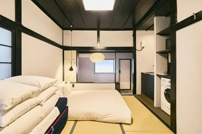 a room with two beds and a window at \u3077\u3075\u304b\u5186\u5fb3\u9418\u30f6\u6df5 in Tokyo