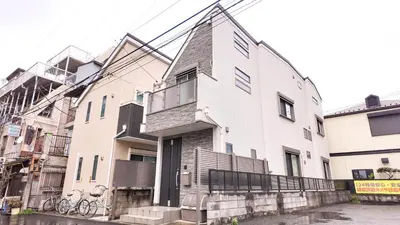 a large white building with a balcony on a street at MSTAY\u9ad8\u7530\u99ac\u5834one in Tokyo