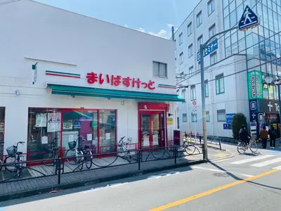 a store with bikes parked outside of it on a street at OHANAJAYAsquare302 in Tokyo