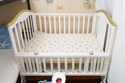 a white crib with a pillow in a bedroom at 2min from ShinKoiwaSta 13min TokyoSta 14guests 4BR in Tokyo