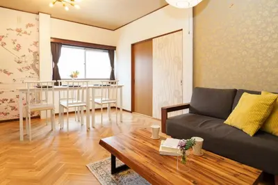 a living room with a couch and a table at 2min from ShinKoiwaSta 13min TokyoSta 14guests 4BR in Tokyo