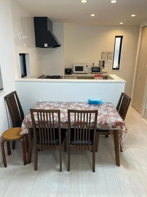 a kitchen with a table and chairs and a kitchen counter at Tokyo Link House Halona-Direct to Shinjuku, Shibuya, Ginza in Tokyo