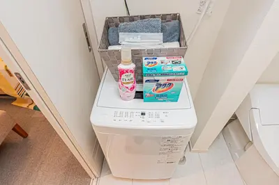 a toilet in a bathroom with some cleaning products on it at 8 min walk to JR Chuo Sobu Line Station Ground Floor Room 13 min to Tokyo Direct Train to Asakusa Shinjuku Ueno Akihabara 22sqm in Tokyo