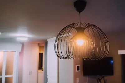 a light fixture hanging from a ceiling in a room at Showa Bloom Cozy Stay Near Shinjuku in Tokyo