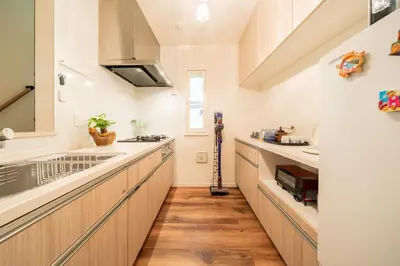 a kitchen with a sink and a counter top at MOMO Garden in Tokyo