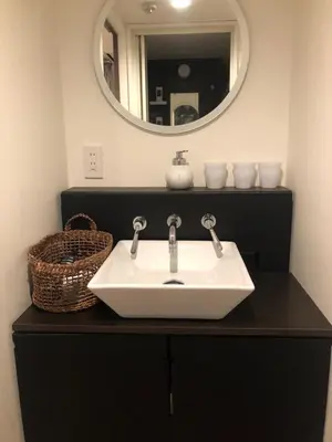a bathroom with a sink and a mirror at Tokyo Asakusa's Local Side in Wada
