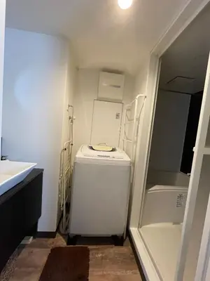 a small kitchen with a refrigerator and a sink at Tokyo Asakusa's Local Side in Wada